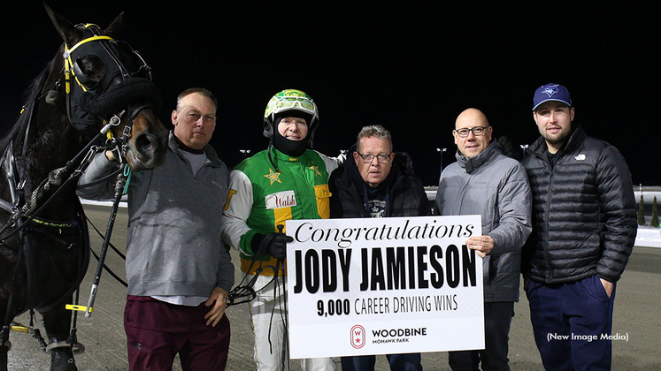 Jody Jamieson receives a presentation for his 9,000th win