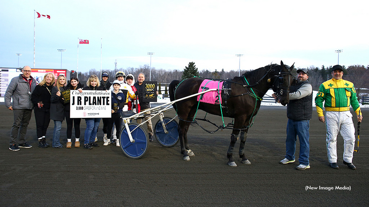 J.R. Plante receives a presentation for his milestone win
