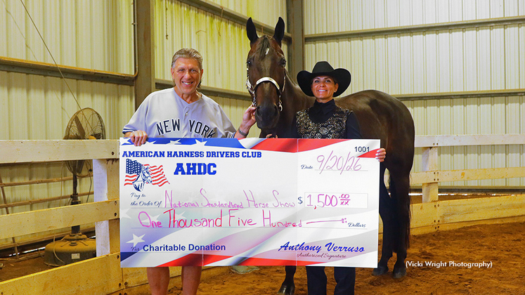 AHDC President Anthony Verruso (left) presenting a donation to Kelly Conn (right) of the SPHO-NJ